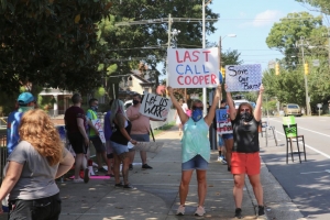 Protesters outside the Executive Mansion in Raleigh urge Gov. Roy Cooper to reopen bars. 