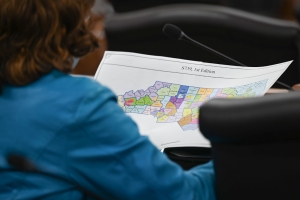 A state lawmaker examines the proposal of new state Senate districts as the N.C. General Assembly members debate the proposed redistricting maps on Tuesday Nov. 2, 2021.