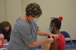 Interim Health Director Cheryl Speight administers a vaccine during a clinic in Dobbins Heights.