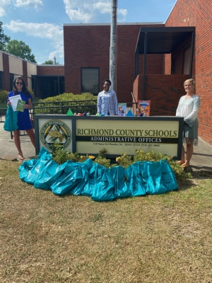 The Richmond County Chapter of the Autism Society of North Carolina recently donated 110 bags filled with sensory items to be distributed to students diagnosed with Autism Spectrum Disorder. From left, Meghann Lambeth, chapter leader; Dr. Amber Watkins, exceptional children director, RCS; Nicole Bowles, chapter treasurer.