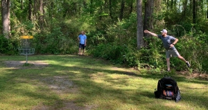 One of 80 players in Richmond County Disc Golf Group&#039;s inaugural Disc Golf for Good Tournament goes for his final throw.