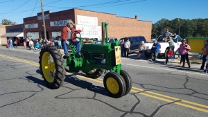 A tractor rolls down Main Street in Ellerbe during the 2018 Farmers Day Parade.