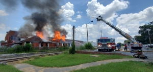 Crews attack a fire from two directions at the old Sara Lee plant office on Mill Road on July 16, 2021.