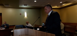 Alan Thompson presents the county&#039;s audit report to the Board of Commissioners on Tuesday.