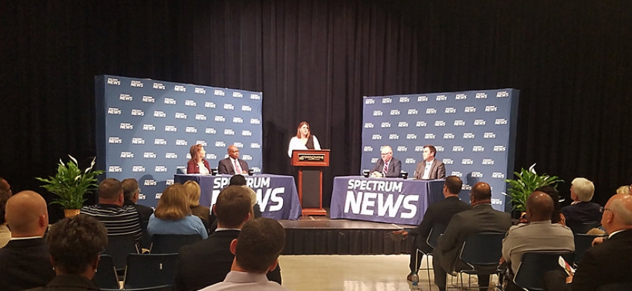 Panelists at the final 2019 N.C. IOPL Hometown Debate Thursday, Oct. 17, in Henderson were, from left, Rep. Donna White, R-Johnston; Rep. Terry Garrison, D-Vance; moderator Loretta Boniti of Spectrum News; Greg Griggs of the Academy of Family Physicians; and Jordan Roberts, health care policy analyst at the John Locke Foundation. 
