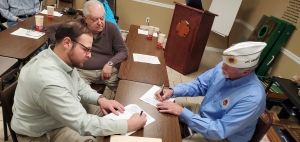 Hamlet City Manager Matthew Christian, left, and AMVETS Post 316 Commander Ed O&#039;Neal sign an agreement for the post to use the former police building behind the American Legion.