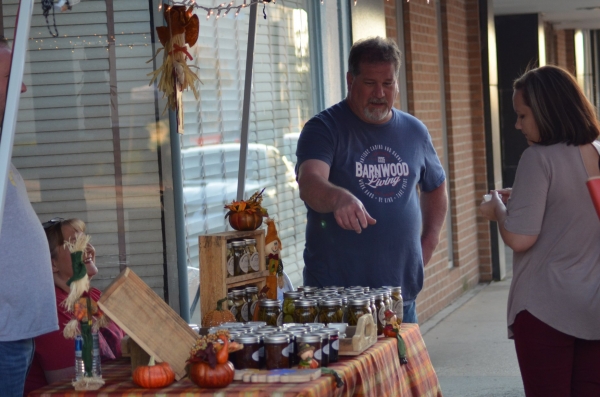 A customer stops by a vendor booth at the October 2019 Affair on the Square.