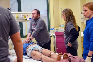  Conner Hutchinson of Rockingham performs chest compressions on a high fidelity mannequin during a disaster drill held at the Simulation Learning Center, a new addition for Richmond Community College’s healthcare programs. Hutchinson graduated from the Associate Degree Nursing program this spring.