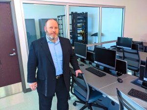Richmond Community College cybersecurity instructor Brian Goodman stands in the classroom that is adjacent to the cybersecurity lab in the Robinette Building. The Cybersecurity Training class is being offered at a discounted price of $99.