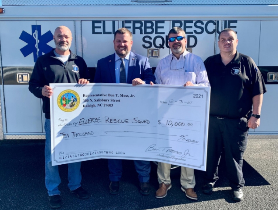 Rep. Ben Moss delivers one of several ceremonial checks to the Ellerbe Rescue Squad on Friday. From left: Bryan Cloninger, Ellerbe Rescue; Moss; County Manager Bryan Land; Emergency Services Director Bob Smith.