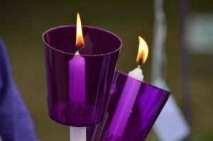 Everyone who attended a candlelight vigil for domestic violence victims Tuesday was given a candle with a purple cover.