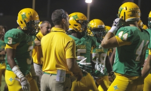 Offensive coordinator Brad Denson meets with his offense during week six&#039;s 28-7 win over Pinecrest.