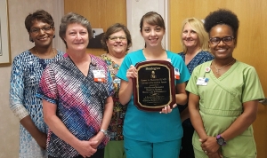 The Wound Care &amp; Hyperbarics program at FirstHealth Moore Regional Hospital-Richmond earns a national award for continued excellence in wound healing. Pictured with the award are Wound Care &amp; Hyperbarics program staff Hazel Seibles, program director; Julie Jones, R.N.; Kellee Greene, LPN-HBO technician; Jennifer Wilson, R.N., clinical nurse manager; Pat Morgan, R.N.; and Tabitha Harris, front office coordinator. Emily Gilner, LPN is not pictured.