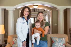 FirstHealth urogynecologist Janet Harris-Hicks, M.D. with patient Laura Fong and her son.