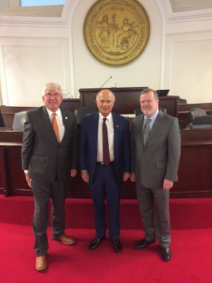 Rockingham Dragway owner Steve Earwood, center, stands flanked by Sen. Tom McInnis, R-Richmond, and Sen. Phil Berger, R-Rockingham, after being recognized by the N.C. Senate.