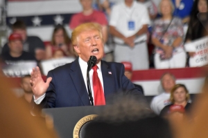President Donald Trump speaks to a crowd of supporters during a rally at East Carolina University on Wednesday.