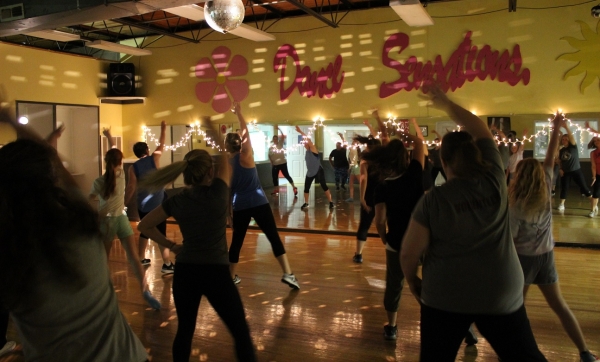 Participants boogie down and get their heart rates up in a Dance Cardio class taught by Mary Kate Lambeth.