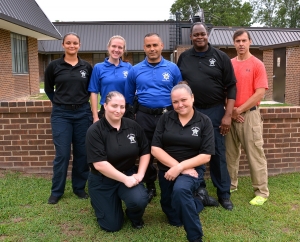  Pictured are, kneeling in front, from left, Amanda Allen and Jessica Watson; in back, from left, Sierra Locklear, Holly Sheppard, Dwight Hunt, Richard Blue and Capt. Earl Haywood, school director for the Detention Officer Certification Course. 