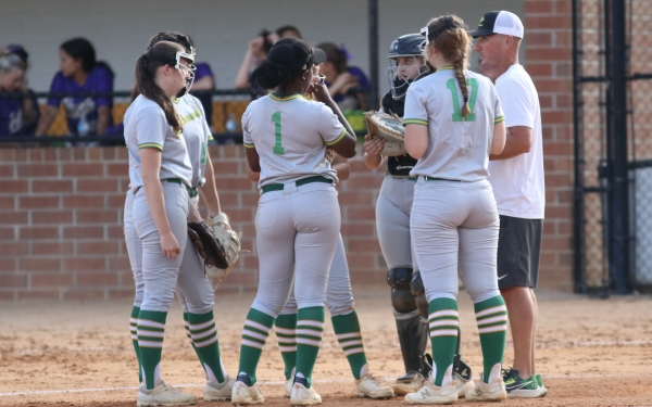 Head coach Mike Way meets with the Lady Raiders during Thursday&#039;s playoff loss to Holly Springs.