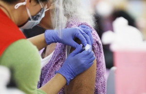 An elderly woman gets a vaccine during a clinic in Durham County in January.