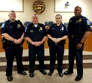 Heather Smith, second from right, was sworn in as an officer with the Hamlet Police Department on Thursday. From left, Patrol Lt. Donald Ray Morton, Capt. Randy Dover, Smith, Chief Tommy McMasters.