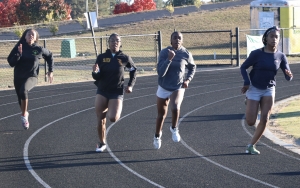 Left to right: Akeya Harrison, Talayeh Covington, Andrea Ellerbe and Isis Covington run sprint drills during Monday&#039;s practice.