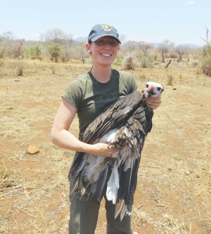Dr. Corinne Kendall, Curator of Conservation and Research for the North Carolina Zoo  On location in Tanzania, Africa with a tagged vulture.