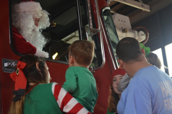 Santa greets kids from a fire truck following breakfast Saturday morning at the Hamlet Fire Department. See more photos at the RO&#039;s Facebook page.