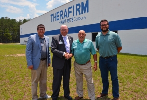 ictured standing in front of the Therafirm plant in Hamlet are, from left, Lee Eller, director of Customized Training for Richmond Community College; Dr. Dale McInnis, College president; Vice President of Therafirm Ken Hartley; and Ross Mason, assistant plant manager. 