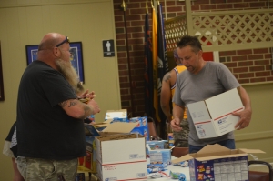 Neil Parrisher and David Goodwin fill care packages at Rockingham VFW Post 4203 on May 21. See the RO&#039;s Facebook page for more photos.