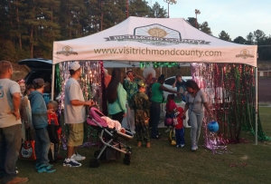 Children decked out in Halloween costumes receive candy during 2016&#039;s Trunk-or-Treat event at Browder Park.