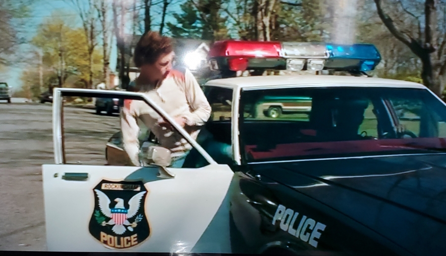JR Moehringer, played by Tye Sheridan, gets into a Rockingham Police car during a later scene in &quot;The Tender Bar,&quot; directed by George Clooney.