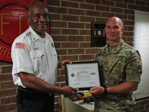 Hamlet Fire Chief Calvin White was recently presented with the Patriot Award by Employer Support of the Guard and Reserve for his  support of Staff Sgt. Gary Chavis.