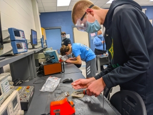 Carson Hadinger practices using a soldering iron during Richmond Community College’s Afterschool STEM program.