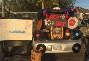 A car decorated with a jukebox and records sits outside Place of Grace Oct. 31 for its &#039;50s on the Hill fall festival.