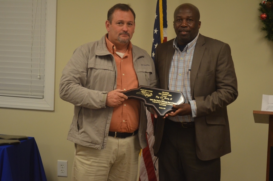 Ellerbe Mayor Lee Berry, left, stands with Fairmont Mayor Charles Townsend after being presented with the first-ever Leon Maynor Local Leadership Award from the Lumber River Council of Governments by Fairmont Mayor 