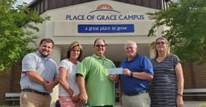 Members of the Richmond County Rescue Mission Board pose with a copy of a $100,000 check from the Richmond Community Foundation. Funds will be used to improve plumbing and install showers, washers and dryers. Pictured, from left: Ben Moss (soon-to-be board member), Debra Richardson, Gary Richardson, Chuck Thames, Rita Thames. Not pictured: Hal Shuler, Terry Lewis, Cheryl Lewis and Deon Cranford.