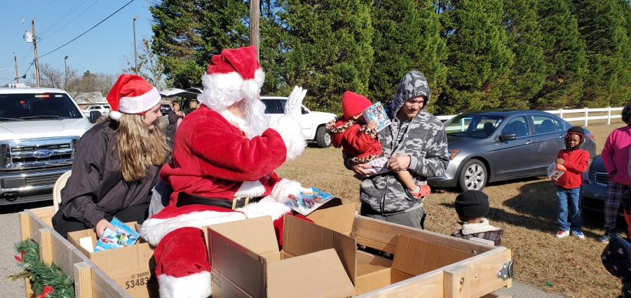 Santa and helpers from the Richmond County Sheriff&#039;s Office hand out toys to children in Ellerbe on Dec. 22. See a video of the full route on the RO&#039;s Facebook page.