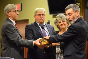 Stephan Futrell, right is joined by his brothers Mark and Ted Futrell, and sister Vera Futrell Wright, as he is sworn in as a superior court judge Tuesday afternoon.