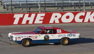 A classic stock car rides along the frontstretch at Rockingham Speedway in November 2021 during Motorsport 4the Masses&#039; Motorfest at Thunder Ally.