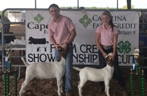 Coleman Lee Berry (left) and Ava Berry (right) show off their goats. Both competed and did well at the 2017 N.C. State Fair.