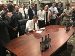 Gov. Roy Cooper signs Senate Bill 290 July 29, 2019 at Greybeard Distillery in Durham.