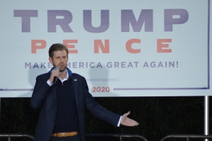 Eric Trump, son of President Donald Trump, speaks to a crowd Friday afternoon in the field behind Ellerbe Springs Inn.