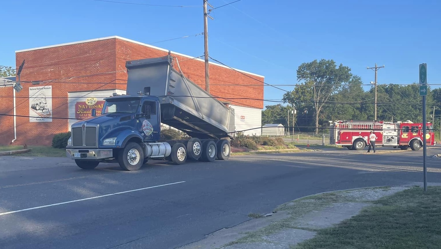 Dump truck tears down power lines in Hamlet; road closed